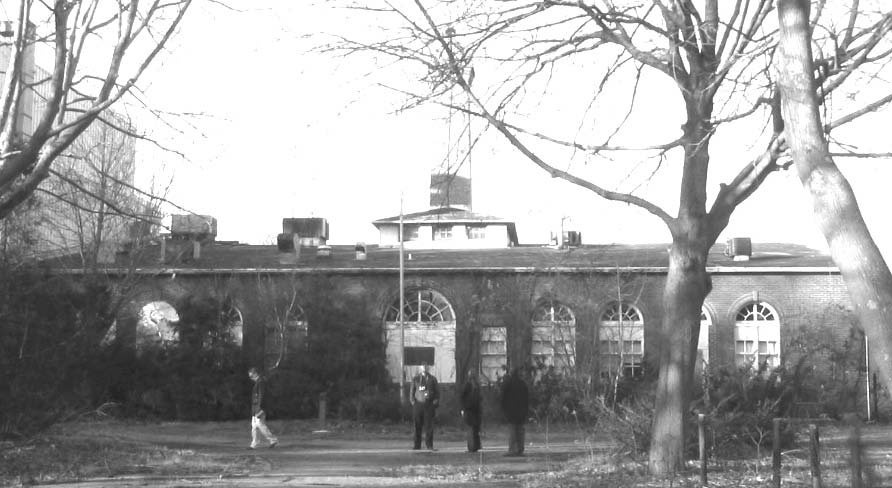 Board members explore the area outside Tesla's Wardenclyffe laboratory.